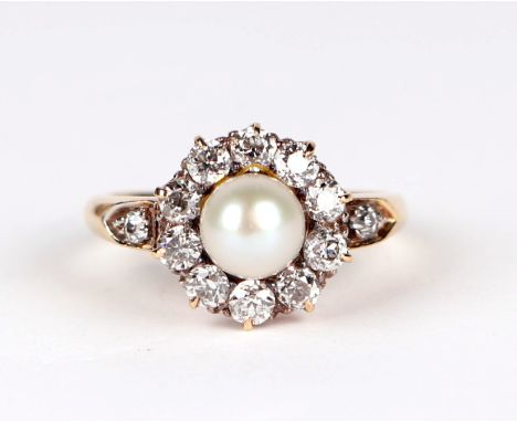 A yellow metal (tests as 18ct) mounted pearl and diamond cluster ring with central untested natural pearl, approx 6.5mm diame