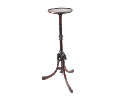 A late 19th century mahogany plant stand on turned column and tripod base, 97cms high.