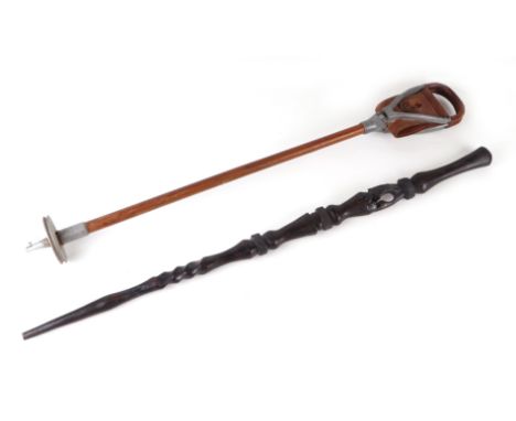 A shooting stick with leather seat and malachite shaft; together with an African carved hardwood walking stick (2).