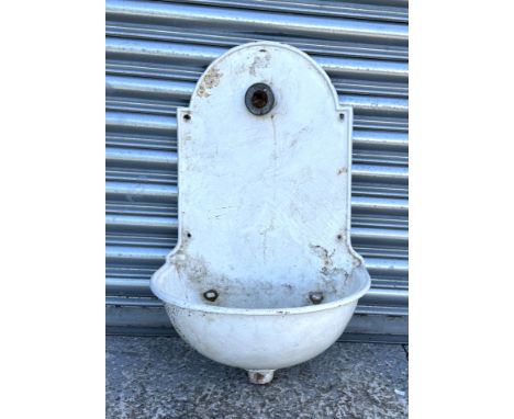 A late Victorian wall mounted water enamel fountain and basin, 42cms wide.