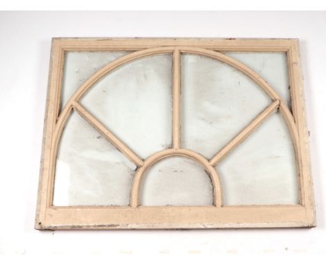 Architectural savage:  A wooden arched over doorway window, 92 by 70cms.