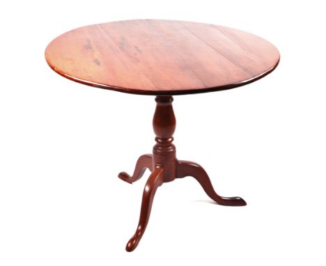 A 19th century mahogany tilt-top tripod table with vase shaped column, 85cms diameter.