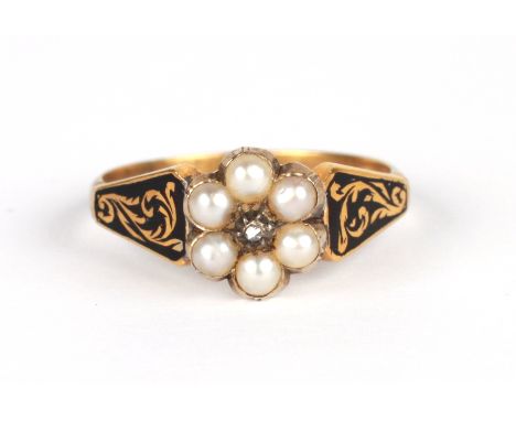 A Georgian mourning ring with seed pearl flowerhead flanked by two black enamel panels, the reverse with a hair plait, approx