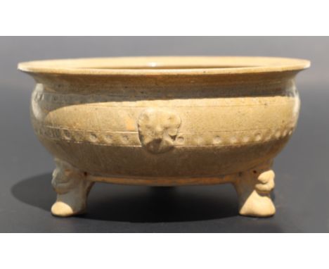 A Chinese monochrome brown glaze tripod footed bowl with incised decoration, 20cm diameter.
