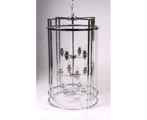 A large twelve-branch chrome and glass pendant ceiling lantern of cylindrical form, 92cms overall height, 50cms diameter.