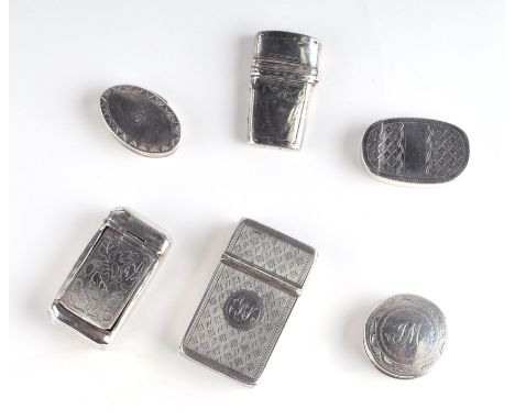 A small collection of Victorian silver vestas and rouge pots to include a Birmingham 1859 example with cigar piercer and engi