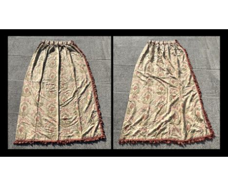 A pair of interlined curtains decorated with roses within oval panels, on a cream ground with pink tassels, approx 96cms wide