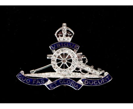 A platinum and 18ct white gold royal Artillery diamond set sweetheart brooch with enamel detail, 7.3g.