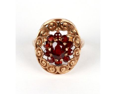 A 9ct gold garnet cluster ring, approx UK size 'K', 4.8g.
