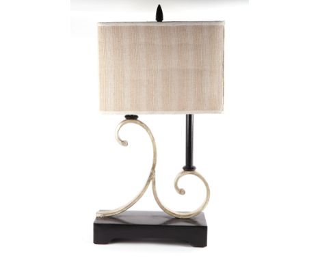 A modern French inspired table lamp with twin scroll support and ebonised base, 36cms wide.
