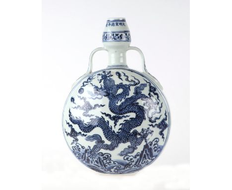 A Chinese blue & white moon flask decorated with dragons amongst clouds, 31cms high.