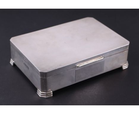 A large tabletop Art Deco style two-division cigarette box with engine turned decoration, Birmingham 1959, 17cms wide, 617g.