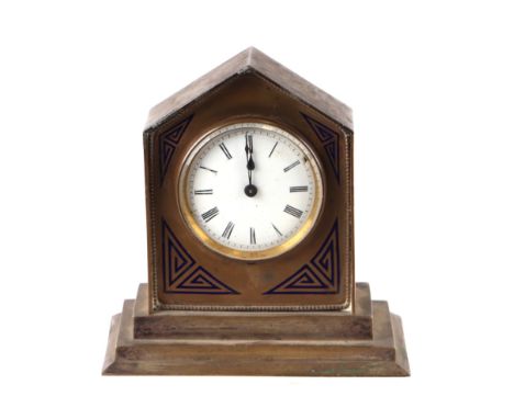 A brass desk clock, the white porcelain dial with Roman numerals, in a Lancet form case with blue enamel decoration, 14cms wi