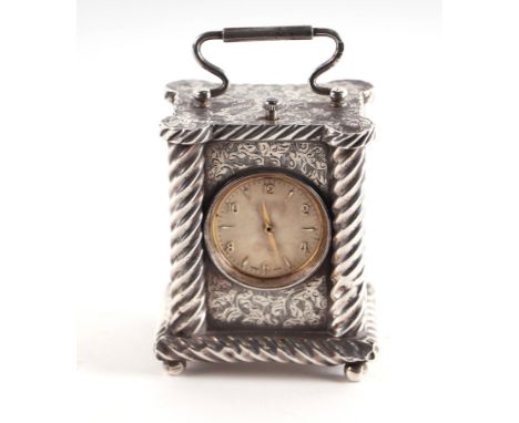 A Victorian silver miniature carriage clock, the panels with chased floral decoration and spiral twist columns, on bun feet, 