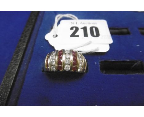 A 9CT DIAMOND AND RUBY RING