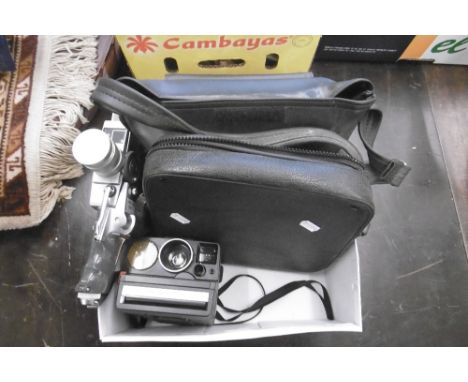 A CINE CAMERA AND A POLAROID CAMERA