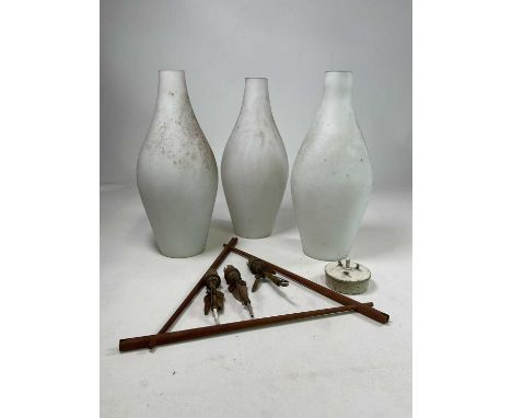 A mid 20th century Danish pendant light with a teak triangular frame supporting three teardrop opaline glass shades, shade he