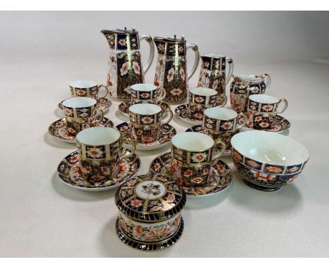 ROYAL CROWN DERBY; a group of Imari decorated wares comprising nine coffee cans and saucers (the majority 1890), two large li