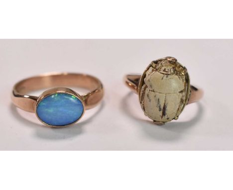 A 9ct yellow gold and opal dress ring, size S 1/2, and a further 9ct gold ring set with a scarab, size O, combined approx 7.5