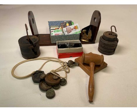 A group of collectors' items including an adjustable book slide, telephone cards, stacking weights, gavel and block, folding 