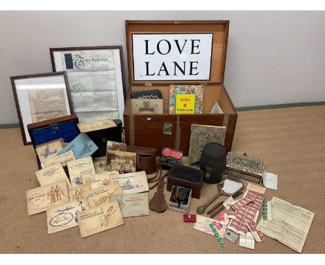 A wooden trunk of collectors' items, to include cigarette card collection, stamp collection, a pair of binoculars, a pair of 