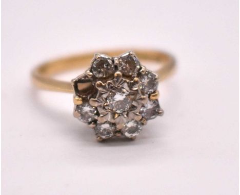 An 18ct yellow gold diamond floral cluster ring, set with eight round brilliant cut stones, each weighing approx. 0.15cts (on