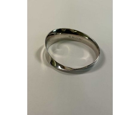 VIVIANNA TORUN BULOW-HUBE FOR GEORG JENSEN; a 206 silver bangle ' Mobius', fully signed and numbered, internal width approx 6