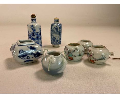 A 19th century Chinese cylindrical snuff bottle decorated with figures in a landscape and with painted four character mark to