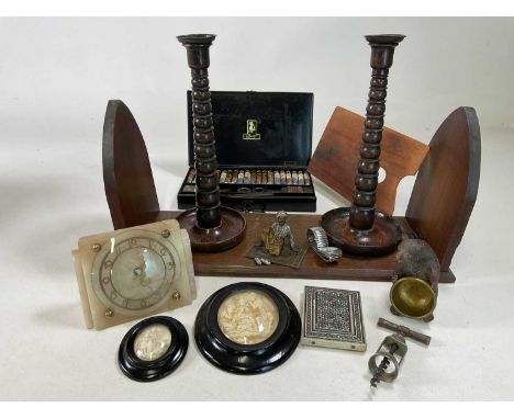 A group of collectors' items including a book slide, artist's tin, Black Forest bear, a pair of candlesticks, an Austrian pai