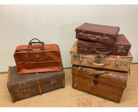 A tin domed trunk, a slat bound trunk, a case and two smaller cases (5).