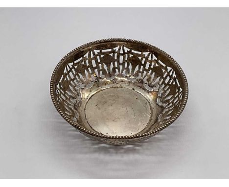 GEORGE HOWSON; an Edward VII hallmarked silver dish with pierced decoration, London 1902, approx weight 1.38 ozt/42.9g. 