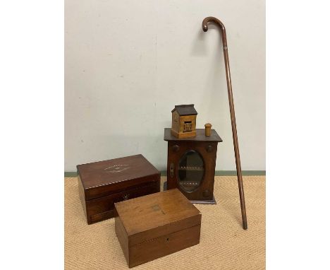 An oak smoker's cabinet with glass drawer to base, a green puzzle money box in the form of a house, a treen dice shaker, a se