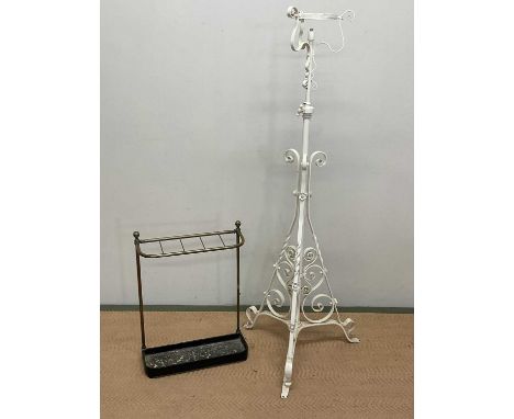An adjustable painted wrought iron floor lamp, height 134cm in lowest position, and a brass umbrella stand.