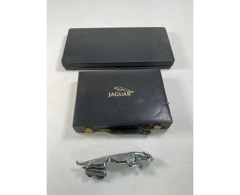 A Jaguar car mascot with a Jaguar cased tool kit and a Jaguar branded games compendiumCondition Report: Contents of the Games