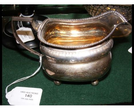 A silver cream jug 