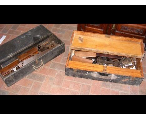 An old tool chest containing various tools and one other 