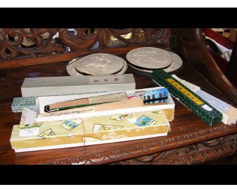 A stock of vintage fans and plaster wall plaques 