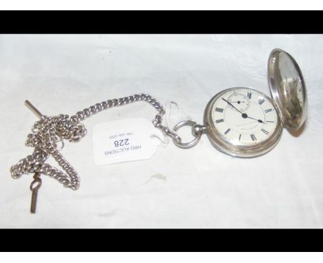 A silver full hunter pocket watch with separate second hand and chain CONDITION REPORTBy our judgement, lot appears to be in 
