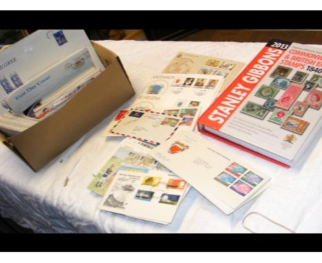 Stanley Gibbons Empire and Commonwealth Stamp Catalogue, together with 250 First Day Covers relating to GB, Ascension and St 