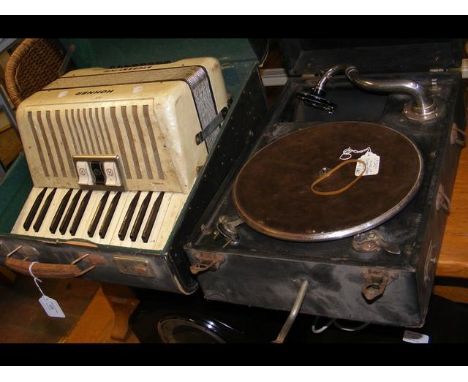 A Hohner piano accordion in carrying case, together with a portable wind up gramophone