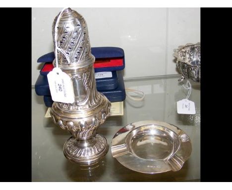 A large silver sugar shaker - 22cm high, together with a silver ashtray 