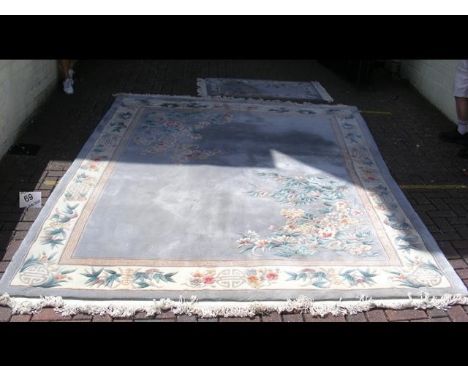 A Chinese carpet - 320cm x 242cm and a small matching rug 