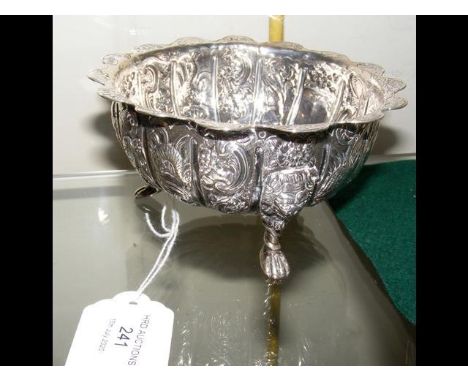 A 13cm diameter silver bowl with repousse decoration 