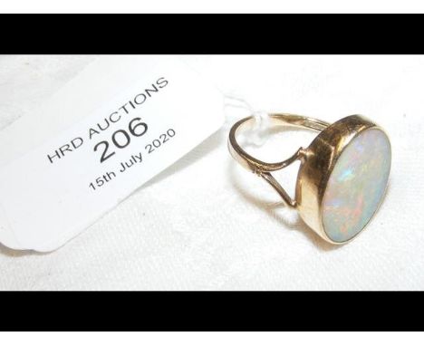 An oval opal ring in gold setting 