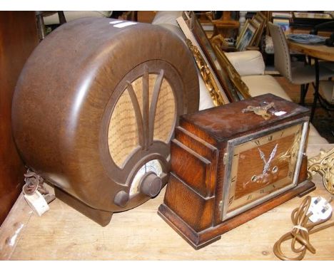 A Retro circular Bakelite radio, together with a mantel clock CONDITION REPORTRegarding the radio -By our judgement, conditio