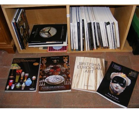 A bundle of auction collection catalogues and vintage football programmes 