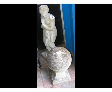 A cast concrete finial, together with a statue 