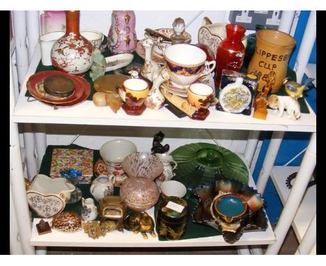 A medley of collectable ceramic and glassware, including Isle of Wight perfume bottle - on two shelves 
