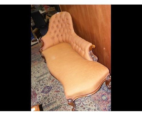 A Victorian chaise longue with button back and cabriole supports 