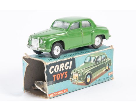 Corgi Toys Rover 90 Saloon (204M). An early mechanical in dark green with a working friction powered motor. Boxed, worn/damag